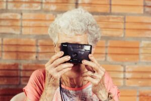 Older woman holding a camera